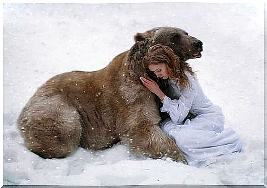 Bear hugs woman