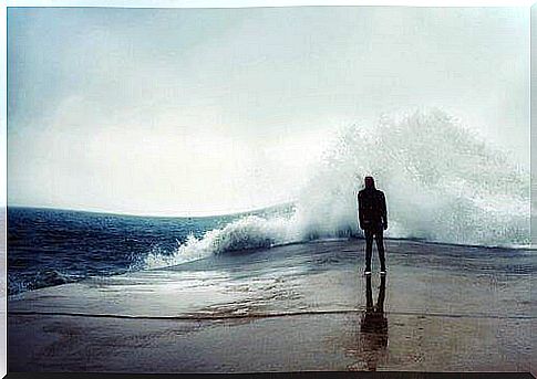 A man watching the waves of the sea